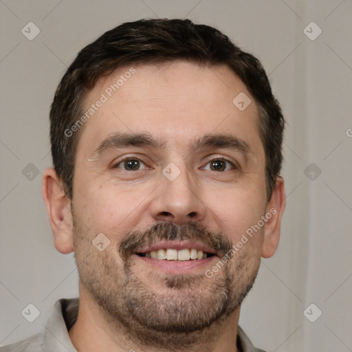 Joyful white adult male with short  brown hair and brown eyes