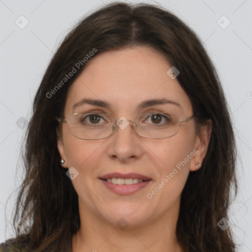 Joyful white adult female with long  brown hair and brown eyes