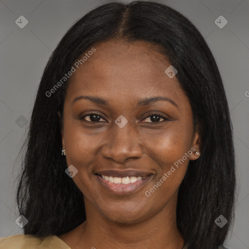 Joyful black young-adult female with long  brown hair and brown eyes