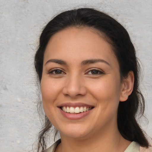 Joyful white young-adult female with long  brown hair and brown eyes