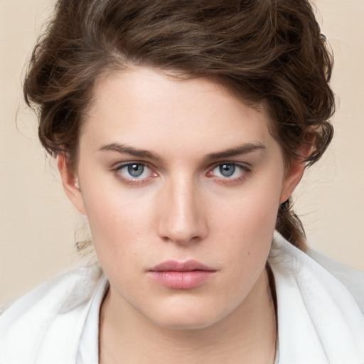 Neutral white young-adult female with medium  brown hair and green eyes