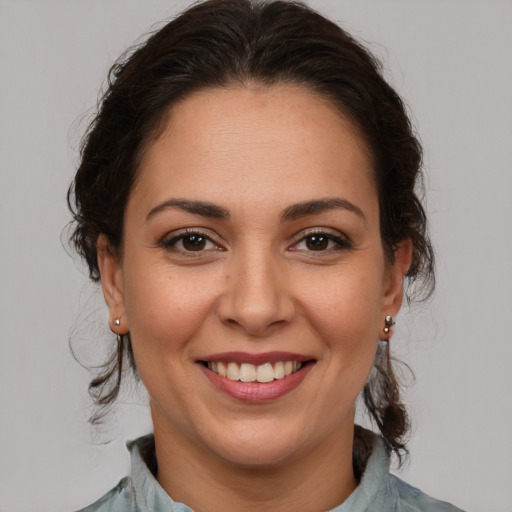 Joyful white young-adult female with medium  brown hair and brown eyes