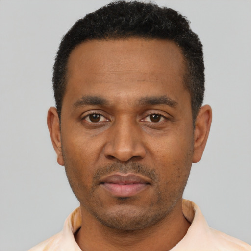 Neutral latino adult male with short  black hair and brown eyes