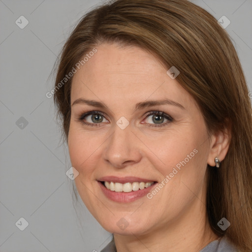 Joyful white adult female with medium  brown hair and brown eyes