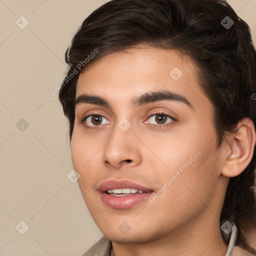 Joyful white young-adult male with medium  brown hair and brown eyes