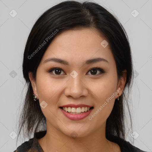 Joyful latino young-adult female with medium  brown hair and brown eyes