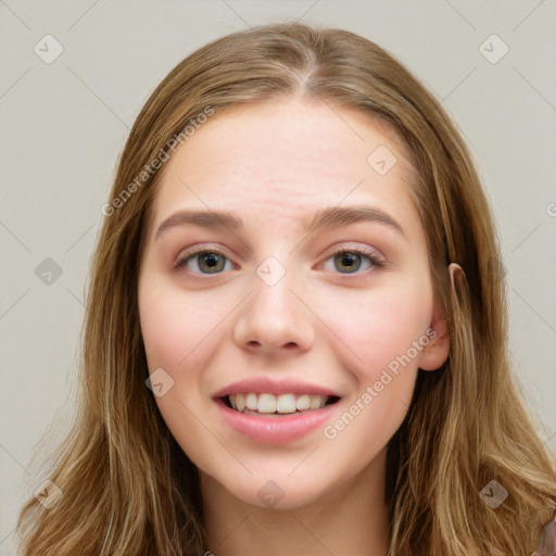 Joyful white young-adult female with long  brown hair and blue eyes