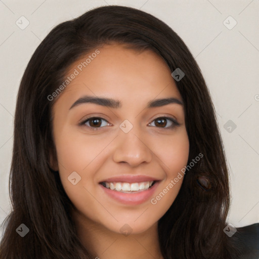 Joyful latino young-adult female with long  brown hair and brown eyes