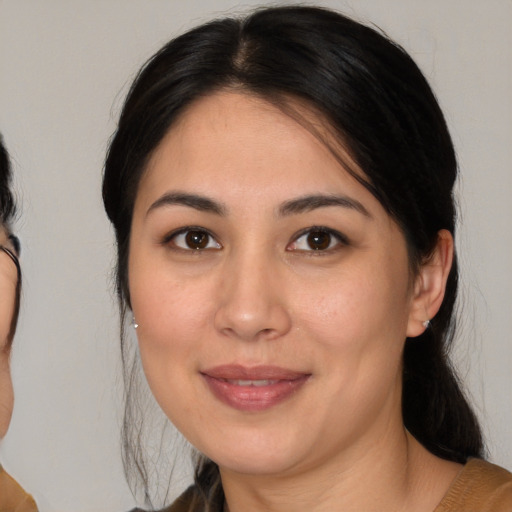 Joyful white adult female with medium  brown hair and brown eyes