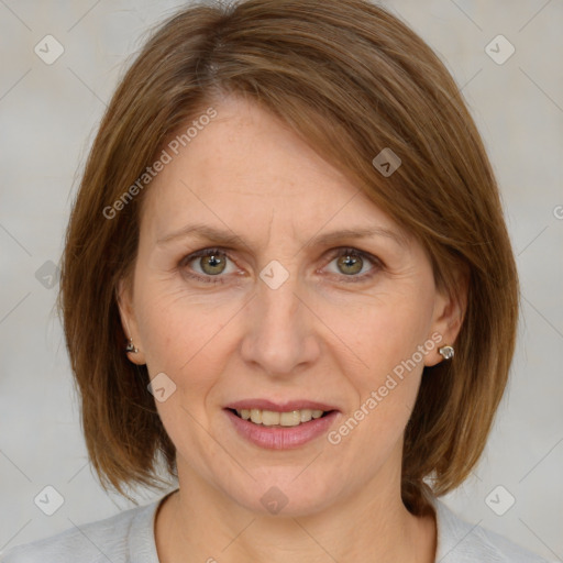 Joyful white adult female with medium  brown hair and blue eyes