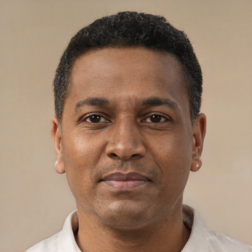 Neutral latino adult male with short  brown hair and brown eyes