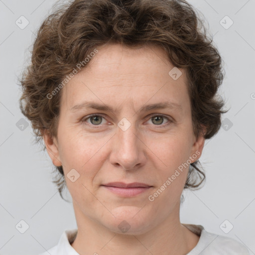 Joyful white adult female with short  brown hair and grey eyes