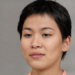 Joyful asian young-adult female with short  brown hair and brown eyes