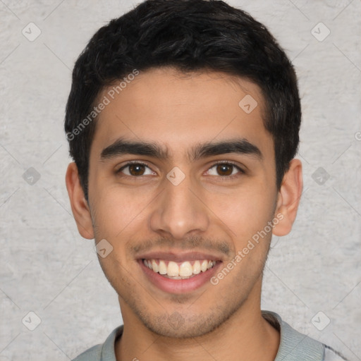 Joyful latino young-adult male with short  brown hair and brown eyes