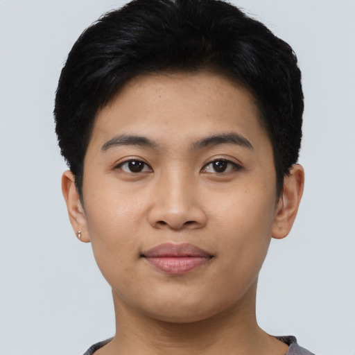 Joyful asian young-adult male with short  black hair and brown eyes