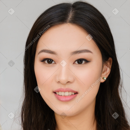 Joyful asian young-adult female with long  brown hair and brown eyes