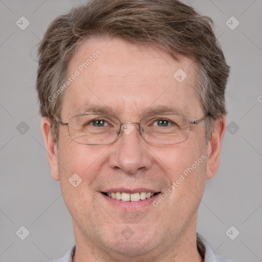 Joyful white adult male with short  brown hair and grey eyes