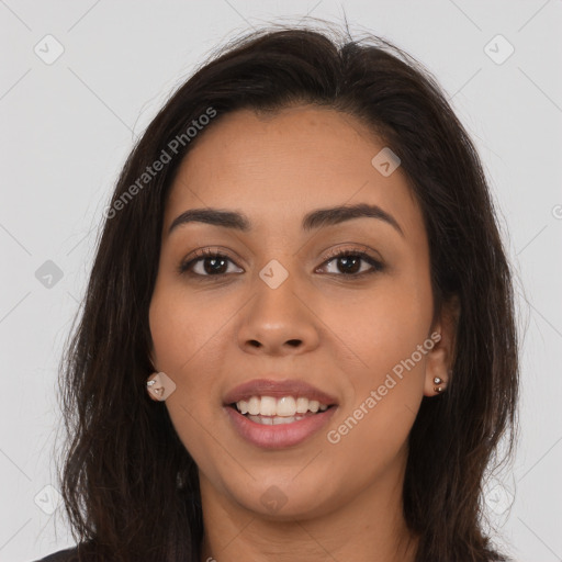 Joyful latino young-adult female with long  brown hair and brown eyes