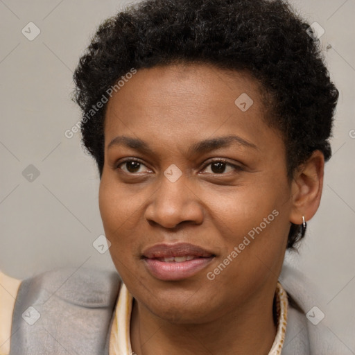 Joyful black young-adult female with short  brown hair and brown eyes