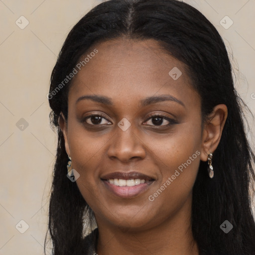 Joyful black young-adult female with long  black hair and brown eyes