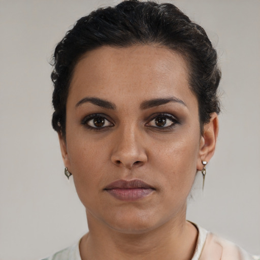 Neutral latino young-adult female with short  brown hair and brown eyes
