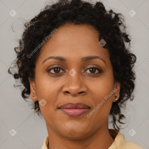 Joyful black adult female with medium  brown hair and brown eyes