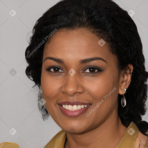 Joyful black young-adult female with long  black hair and brown eyes