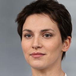 Joyful white adult female with short  brown hair and brown eyes