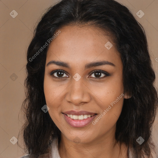 Joyful black young-adult female with long  brown hair and brown eyes