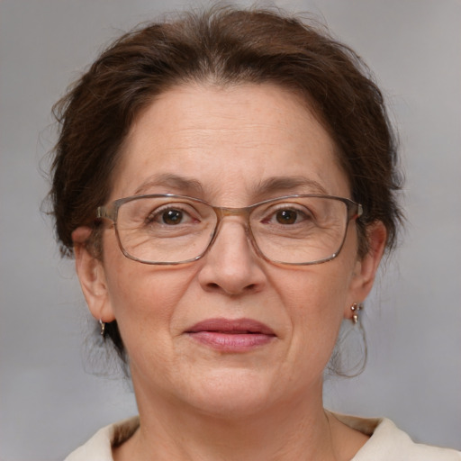 Joyful white middle-aged female with medium  brown hair and brown eyes