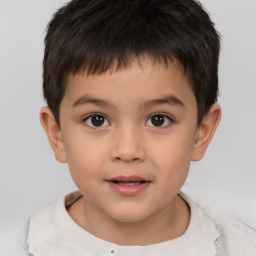 Joyful white child male with short  brown hair and brown eyes