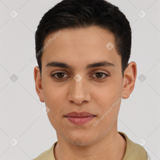 Joyful latino young-adult male with short  black hair and brown eyes