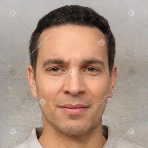 Joyful white adult male with short  brown hair and brown eyes