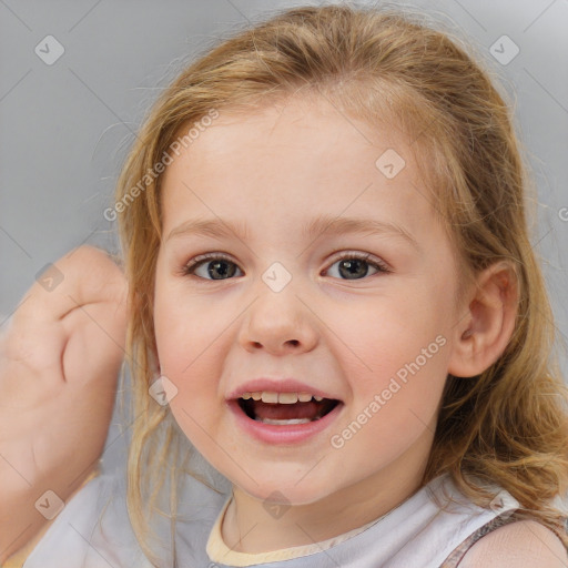 Joyful white child female with medium  brown hair and brown eyes