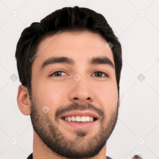 Joyful white young-adult male with short  black hair and brown eyes