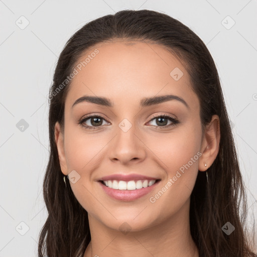 Joyful white young-adult female with long  brown hair and brown eyes