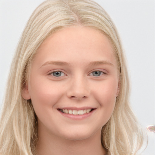 Joyful white young-adult female with long  blond hair and blue eyes