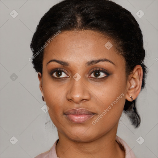 Joyful black young-adult female with short  brown hair and brown eyes