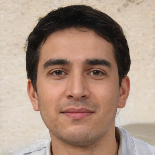Neutral white young-adult male with short  black hair and brown eyes