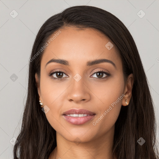 Joyful latino young-adult female with long  black hair and brown eyes