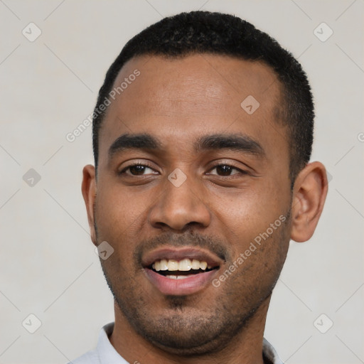 Joyful black young-adult male with short  black hair and brown eyes