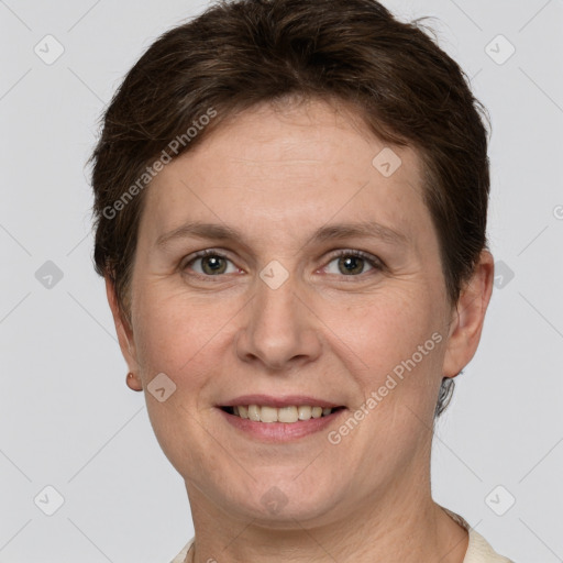 Joyful white adult female with short  brown hair and grey eyes