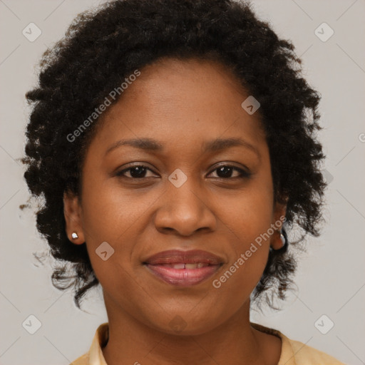 Joyful black adult female with short  brown hair and brown eyes