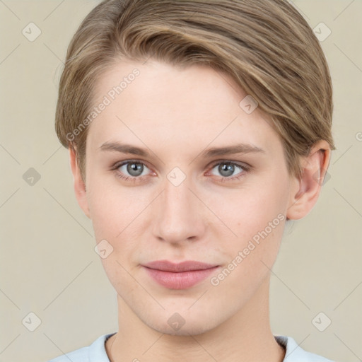 Joyful white young-adult female with short  brown hair and grey eyes