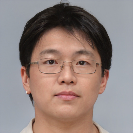 Neutral asian adult male with short  brown hair and brown eyes