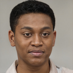 Joyful latino young-adult male with short  brown hair and brown eyes