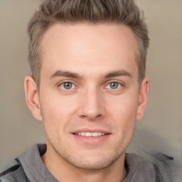 Joyful white adult male with short  brown hair and grey eyes