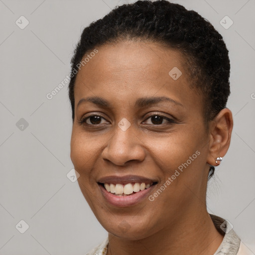 Joyful black young-adult female with short  brown hair and brown eyes