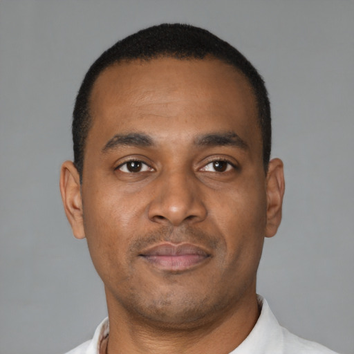 Neutral black young-adult male with short  brown hair and brown eyes
