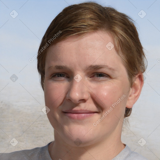 Joyful white young-adult female with medium  brown hair and blue eyes